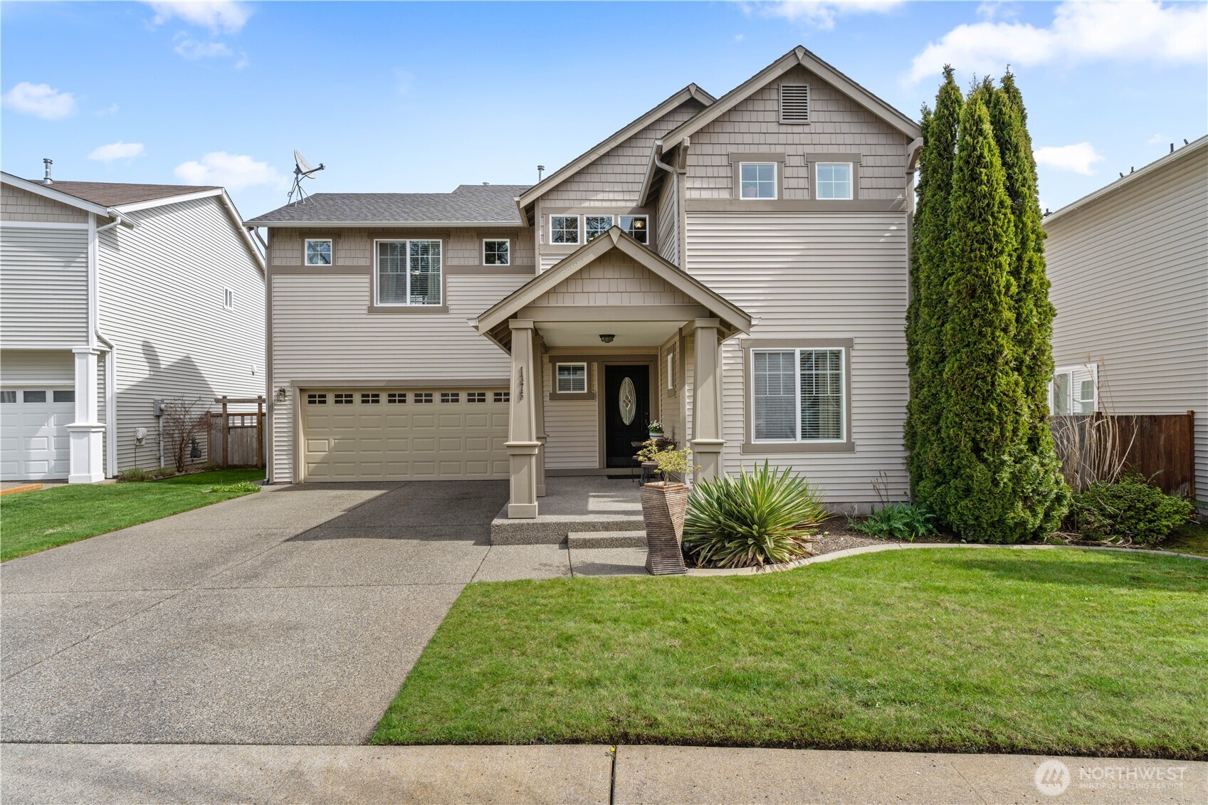 1375 Foreman Road DuPont, WA 98327 - Photo 2 of 30 a front view of a house with garden