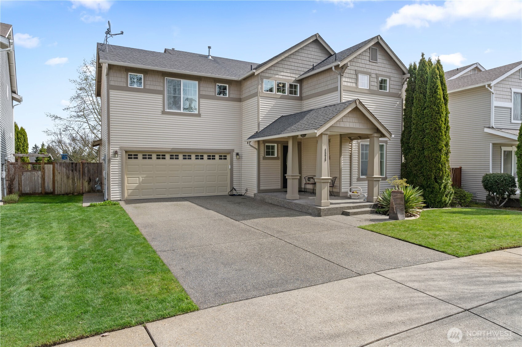 1375 Foreman Road DuPont, WA 98327 - Photo 30 of 30 a front view of a house with a yard and garage