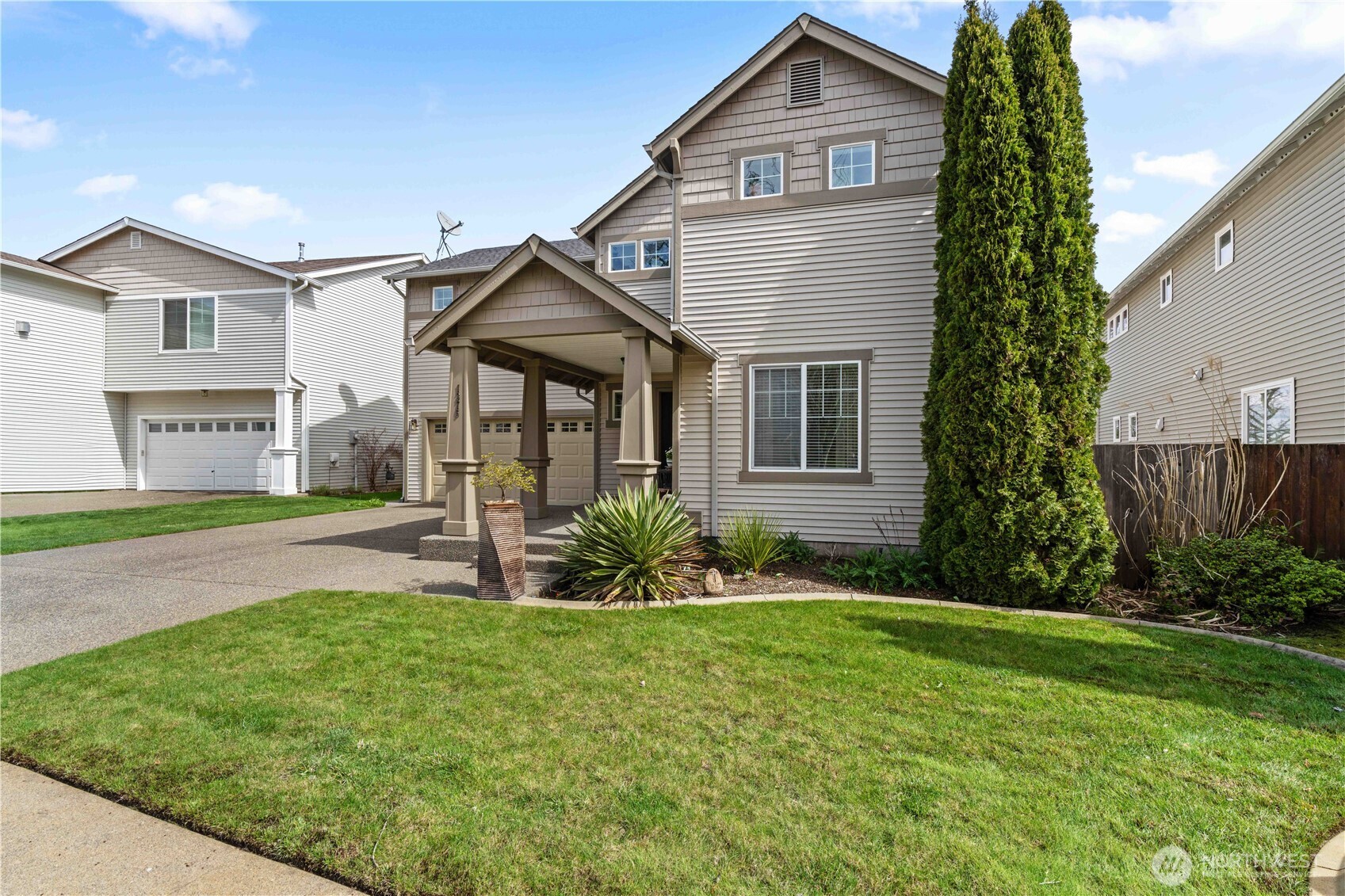 1375 Foreman Road DuPont, WA 98327 - Photo 3 of 30 a front view of a house with a yard