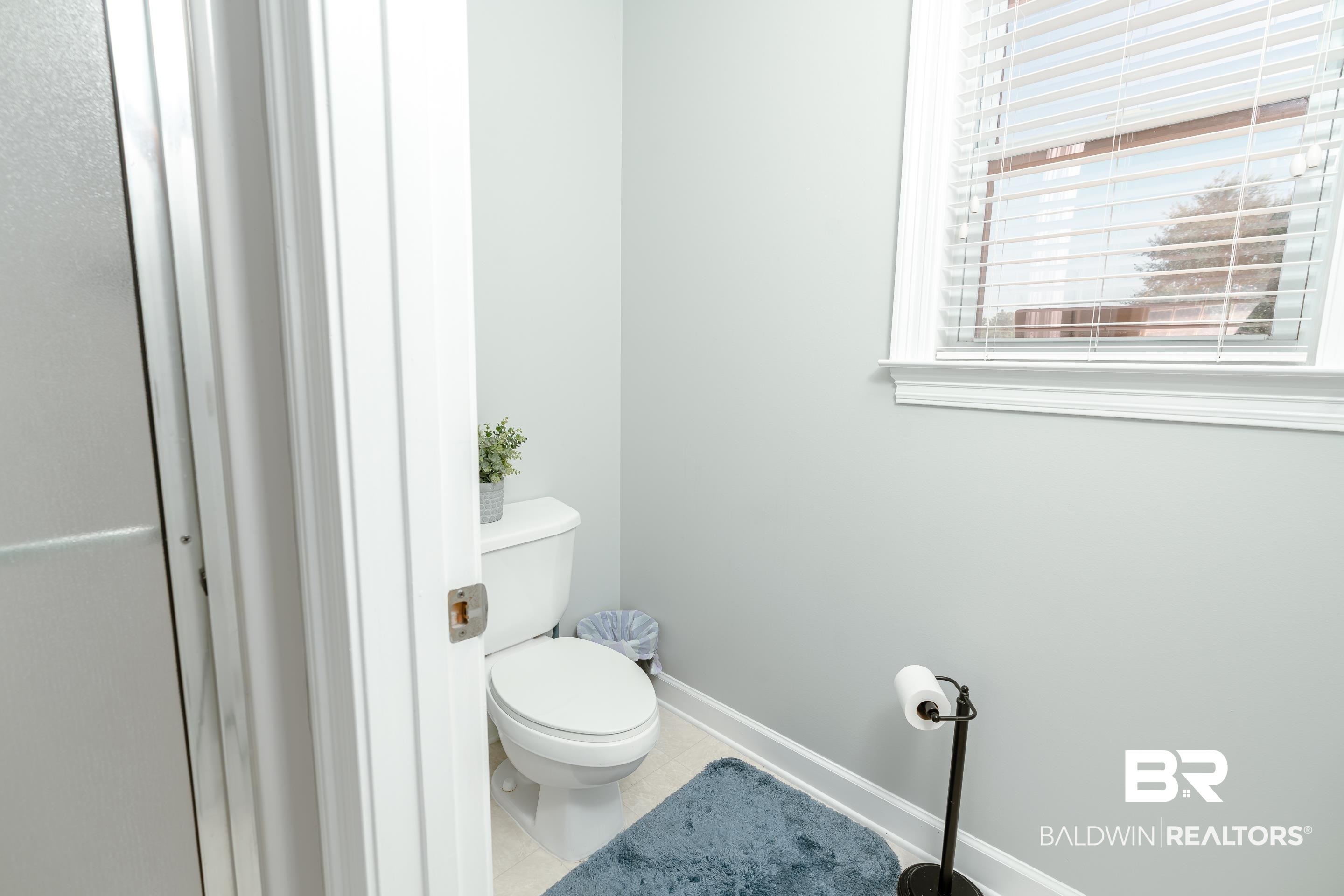 9477 Deerfield Drive Irvington, AL 36544 - Photo 24 of 58 Bathroom featuring tile patterned floors and toilet