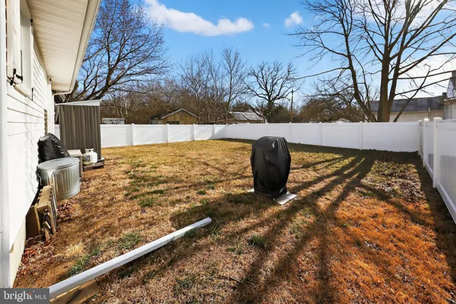 a view of roof with wooden fence