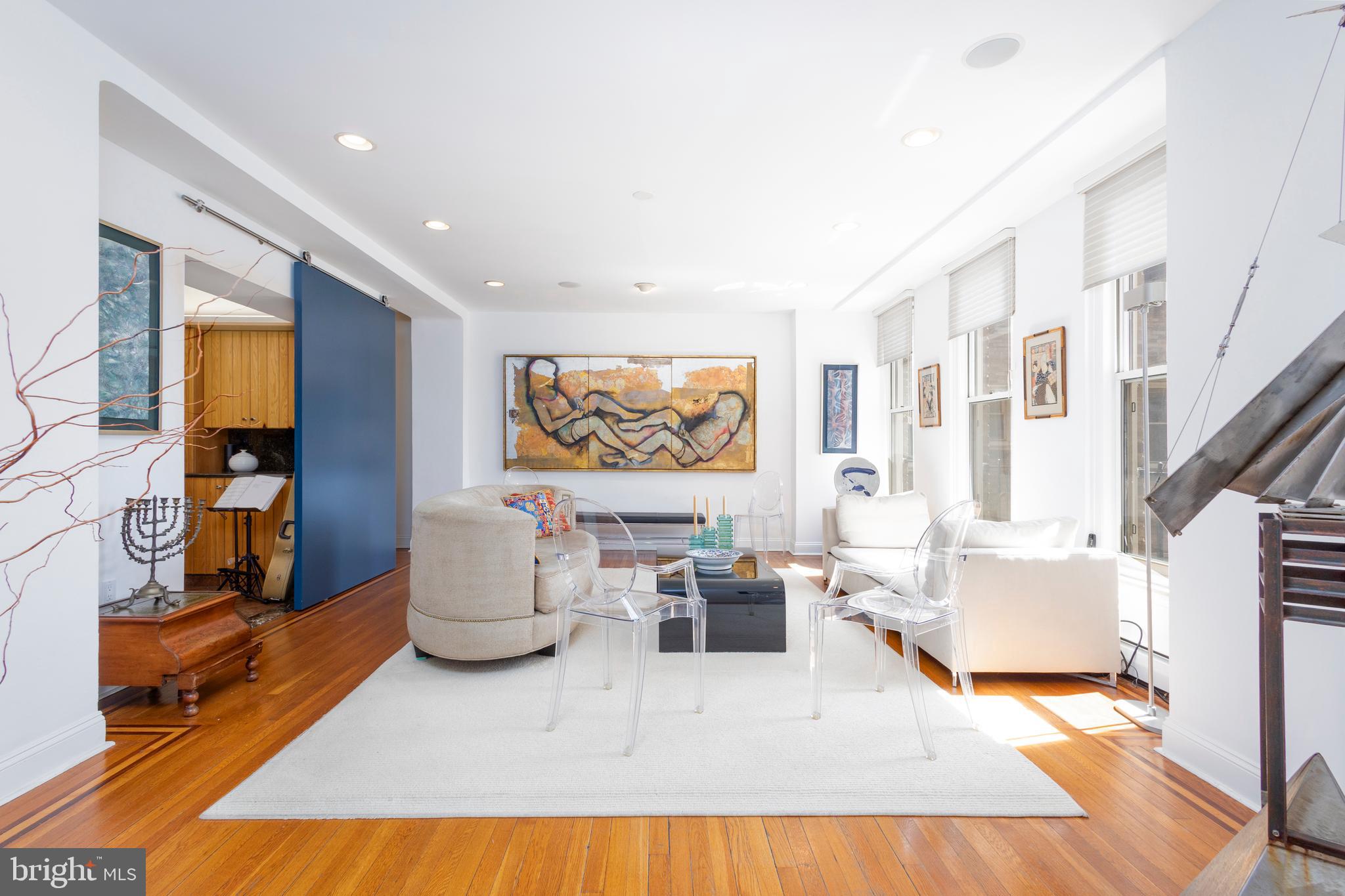 1901 Walnut Street, Unit 15B Philadelphia, PA 19103 - Photo 1 of 36 a living room with furniture and a flat screen tv