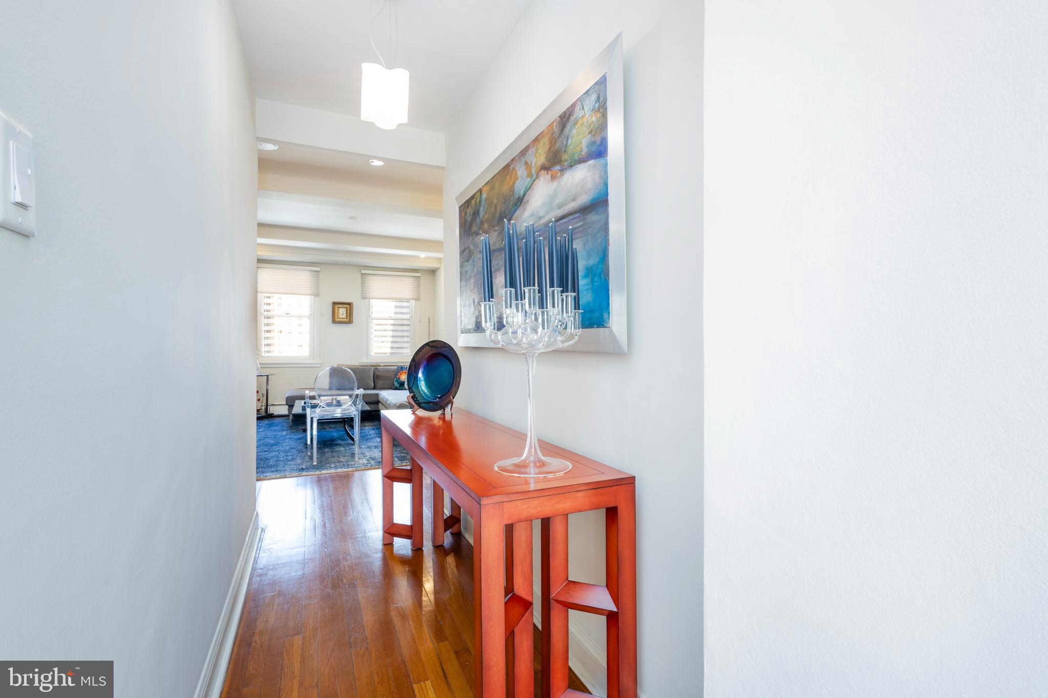 1901 Walnut Street, Unit 15B Philadelphia, PA 19103 - Photo 14 of 36 a dining room with furniture and wooden floor