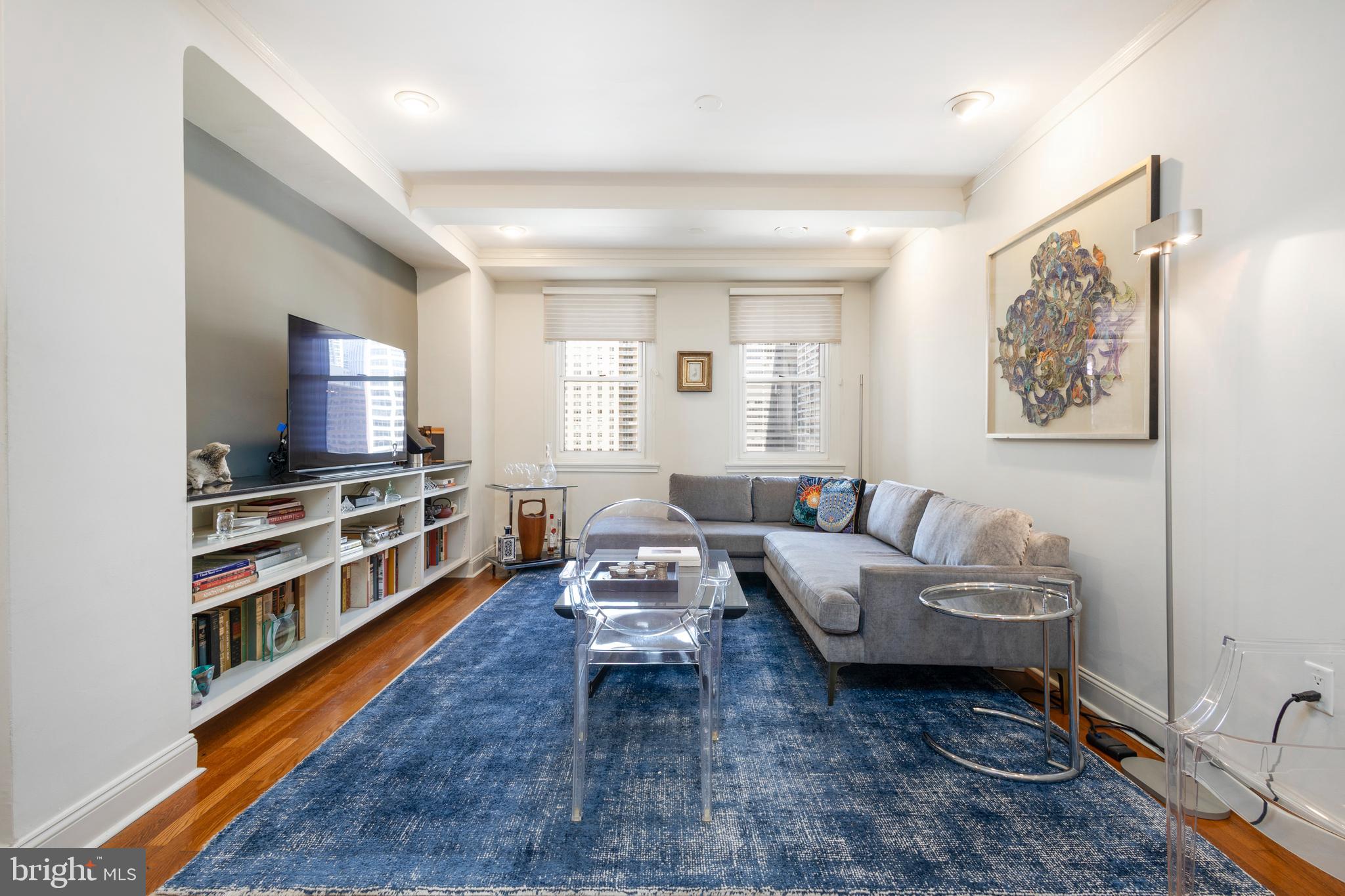 1901 Walnut Street, Unit 15B Philadelphia, PA 19103 - Photo 16 of 36 a living room with furniture and a flat screen tv