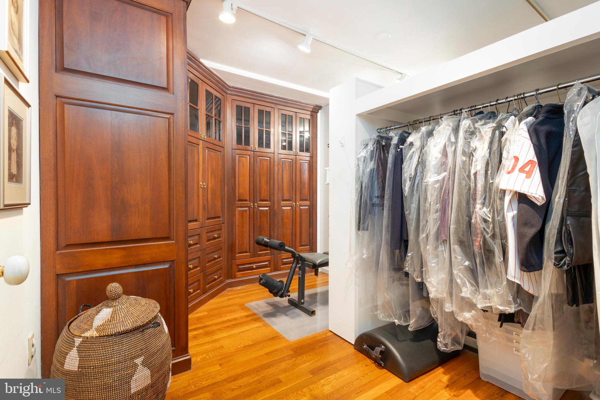 1901 Walnut Street, Unit 15B Philadelphia, PA 19103 - Photo 18 of 36 a view of walk in closet with clothes and shoes