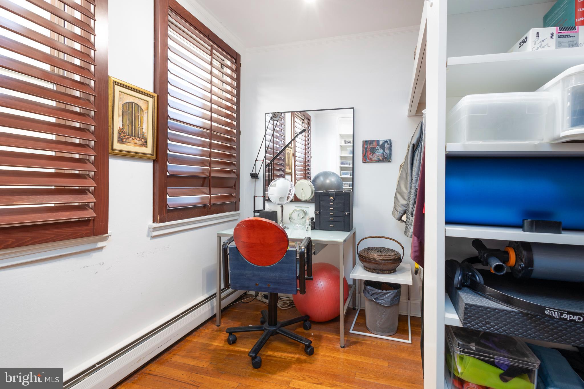 1901 Walnut Street, Unit 15B Philadelphia, PA 19103 - Photo 19 of 36 a view of a workspace with furniture and a window