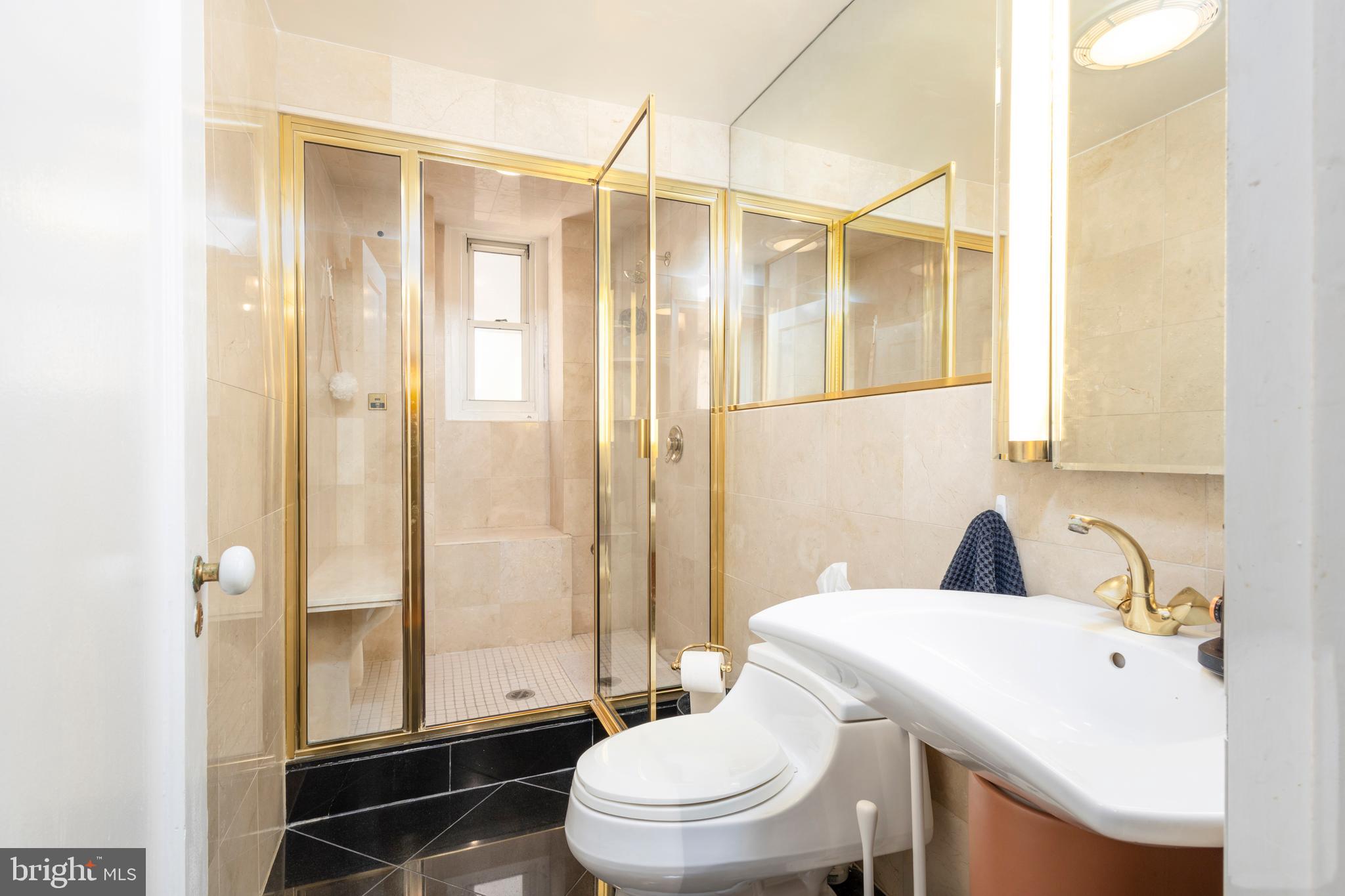 1901 Walnut Street, Unit 15B Philadelphia, PA 19103 - Photo 20 of 36 a bathroom with a sink toilet and shower