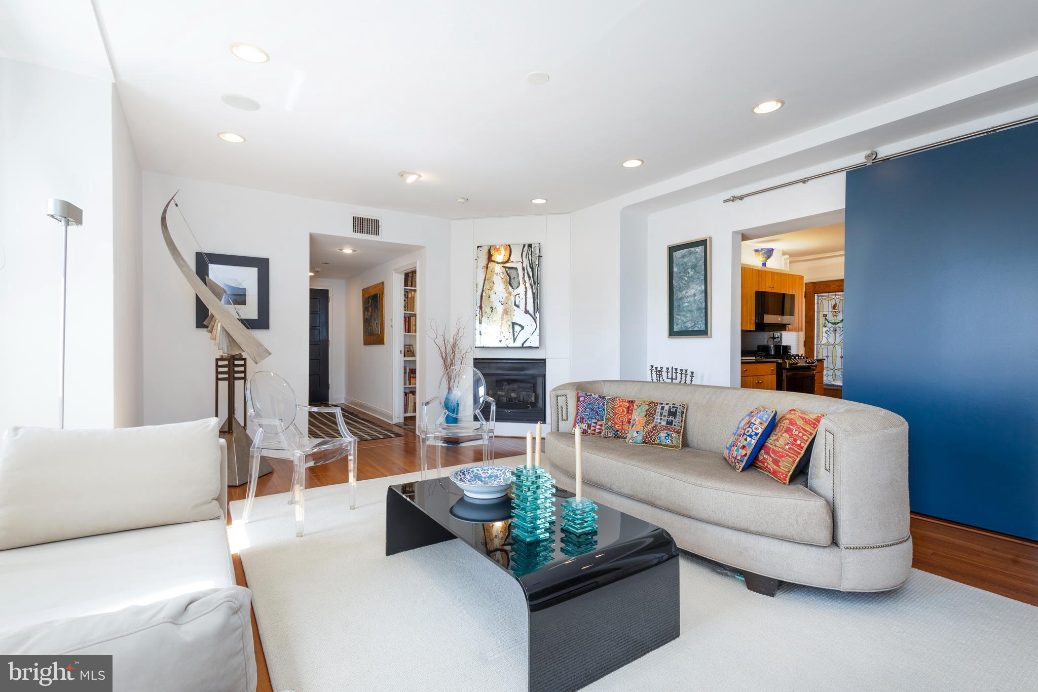1901 Walnut Street, Unit 15B Philadelphia, PA 19103 - Photo 2 of 36 a living room with furniture and a couch