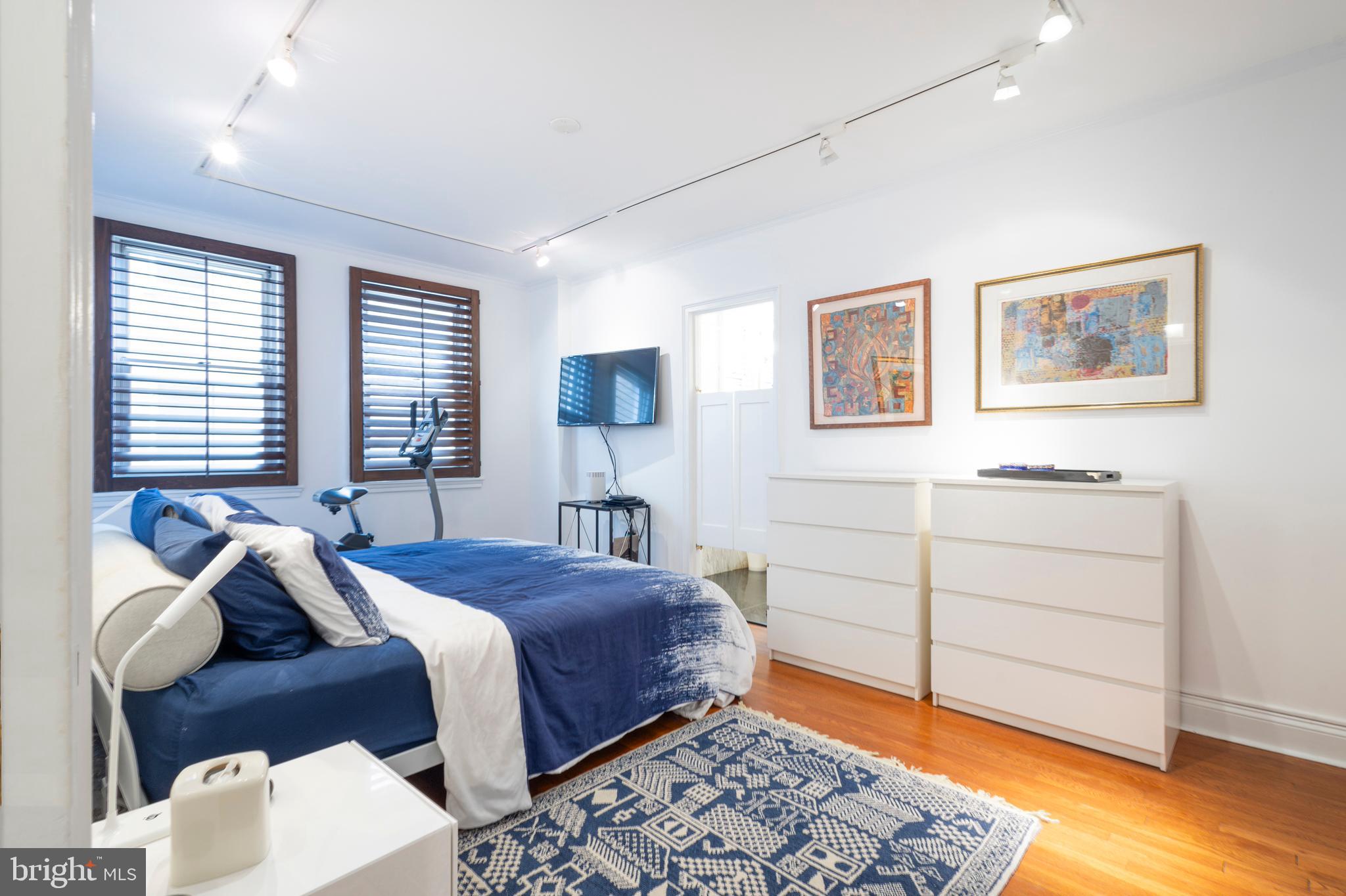 1901 Walnut Street, Unit 15B Philadelphia, PA 19103 - Photo 22 of 36 a bedroom with a bed and a window