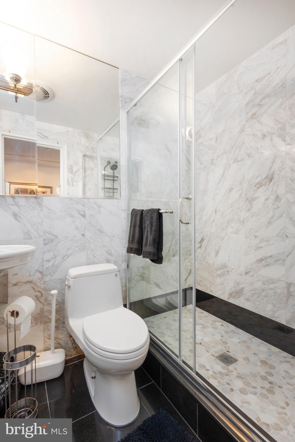 1901 Walnut Street, Unit 15B Philadelphia, PA 19103 - Photo 23 of 36 a bathroom with a toilet and a shower