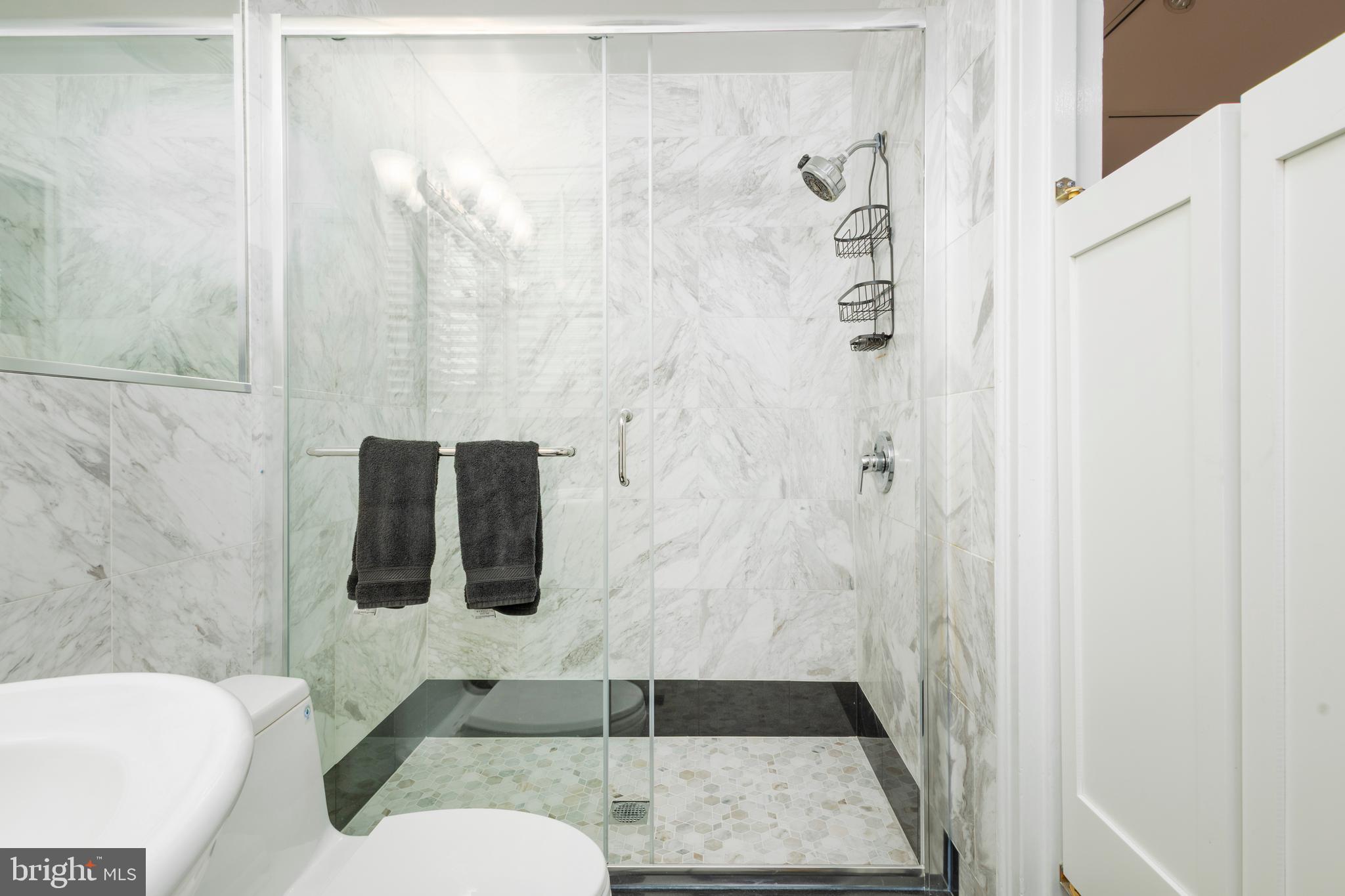 1901 Walnut Street, Unit 15B Philadelphia, PA 19103 - Photo 24 of 36 a bathroom with a shower and toilet