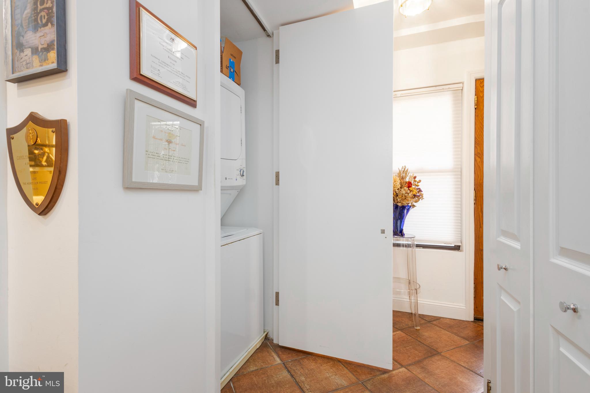 1901 Walnut Street, Unit 15B Philadelphia, PA 19103 - Photo 25 of 36 a view of storage and utility room with washer and dryer
