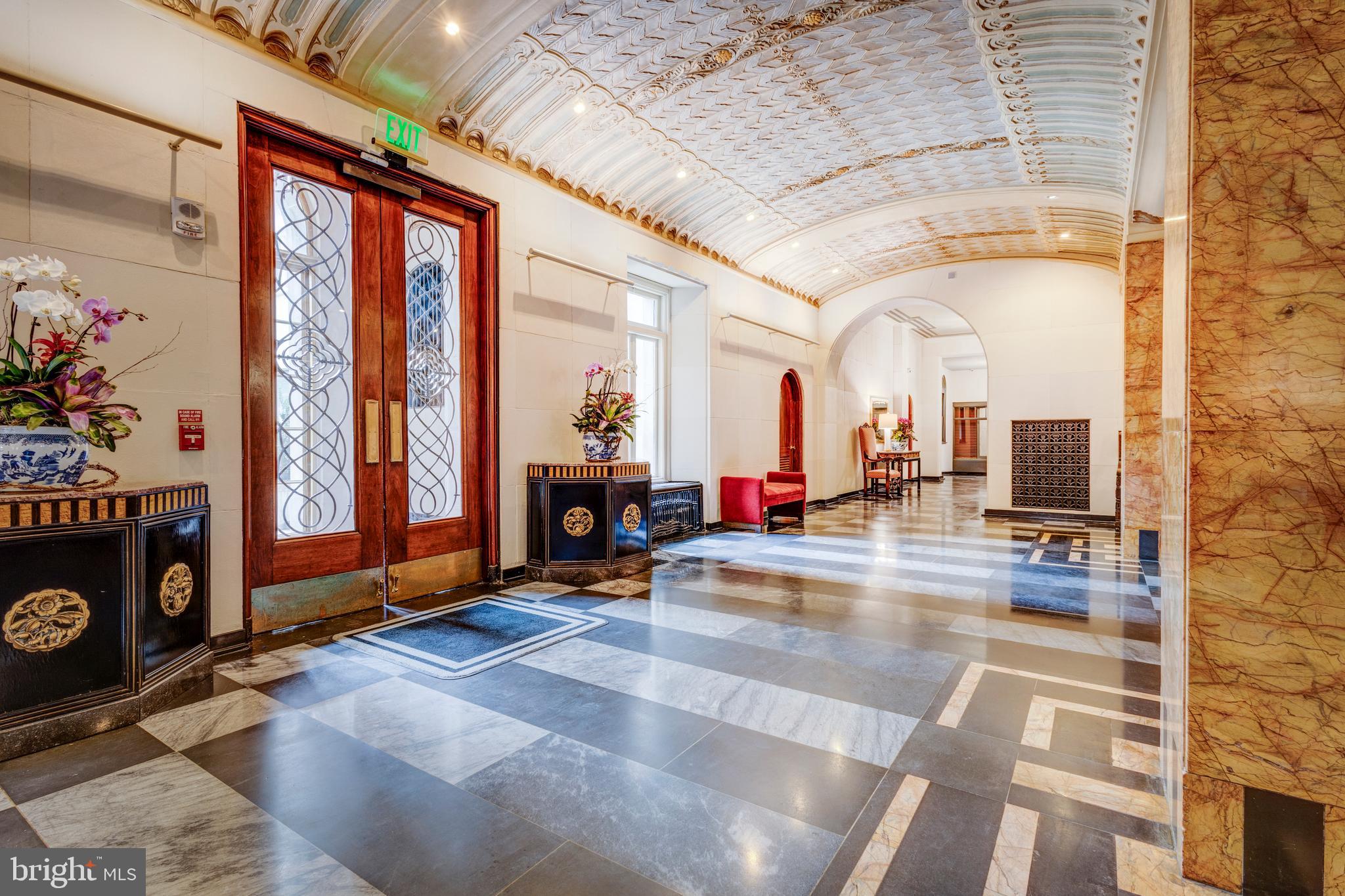 1901 Walnut Street, Unit 15B Philadelphia, PA 19103 - Photo 29 of 36 a lobby with furniture and floor to ceiling window