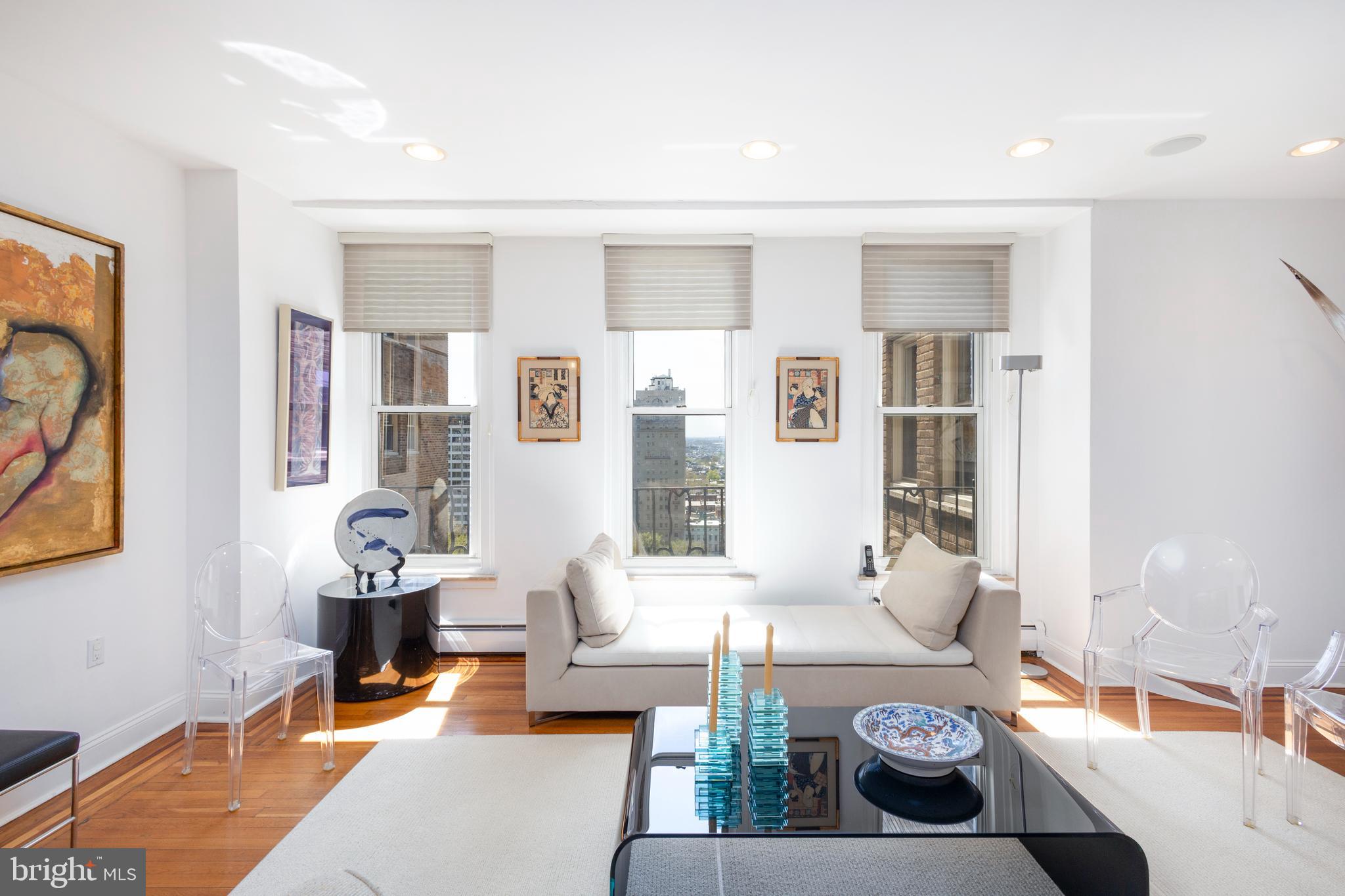 1901 Walnut Street, Unit 15B Philadelphia, PA 19103 - Photo 3 of 36 a living room with furniture and wooden floor