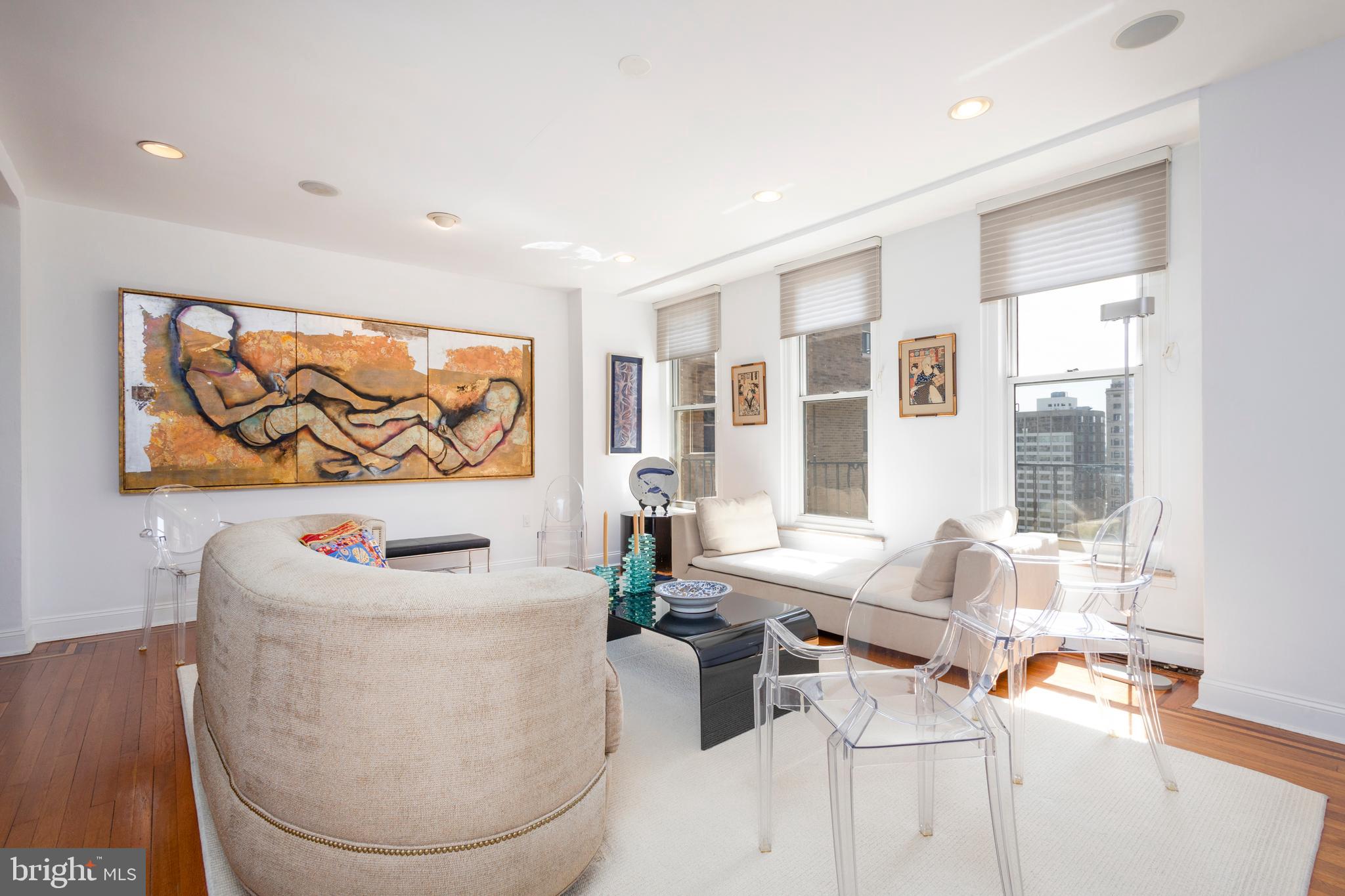 1901 Walnut Street, Unit 15B Philadelphia, PA 19103 - Photo 5 of 36 a living room with furniture and a large window