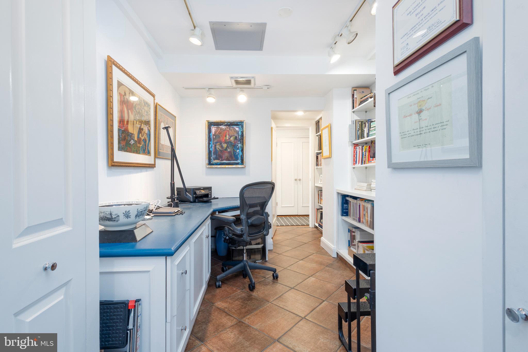 1901 Walnut Street, Unit 15B Philadelphia, PA 19103 - Photo 7 of 36 a view of a workspace with furniture and a window