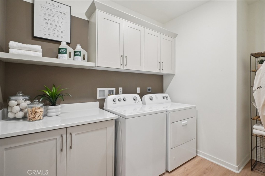 73525 Raphael Drive Palm Desert, CA 92211 - Photo 34 of 41 a utility room with sink dryer and washer