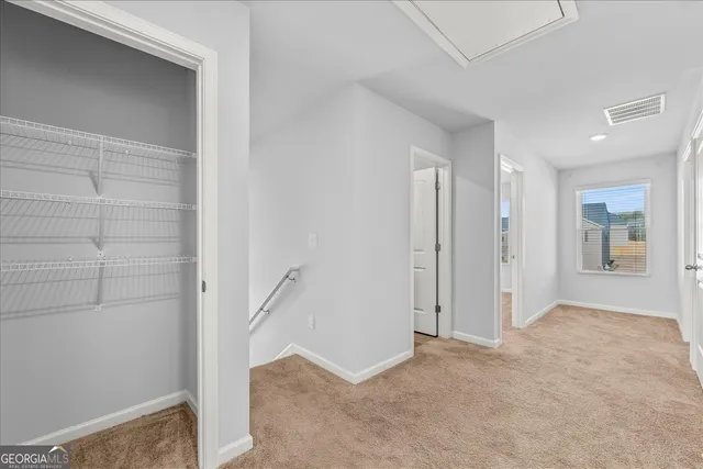 a view of entryway with bathroom