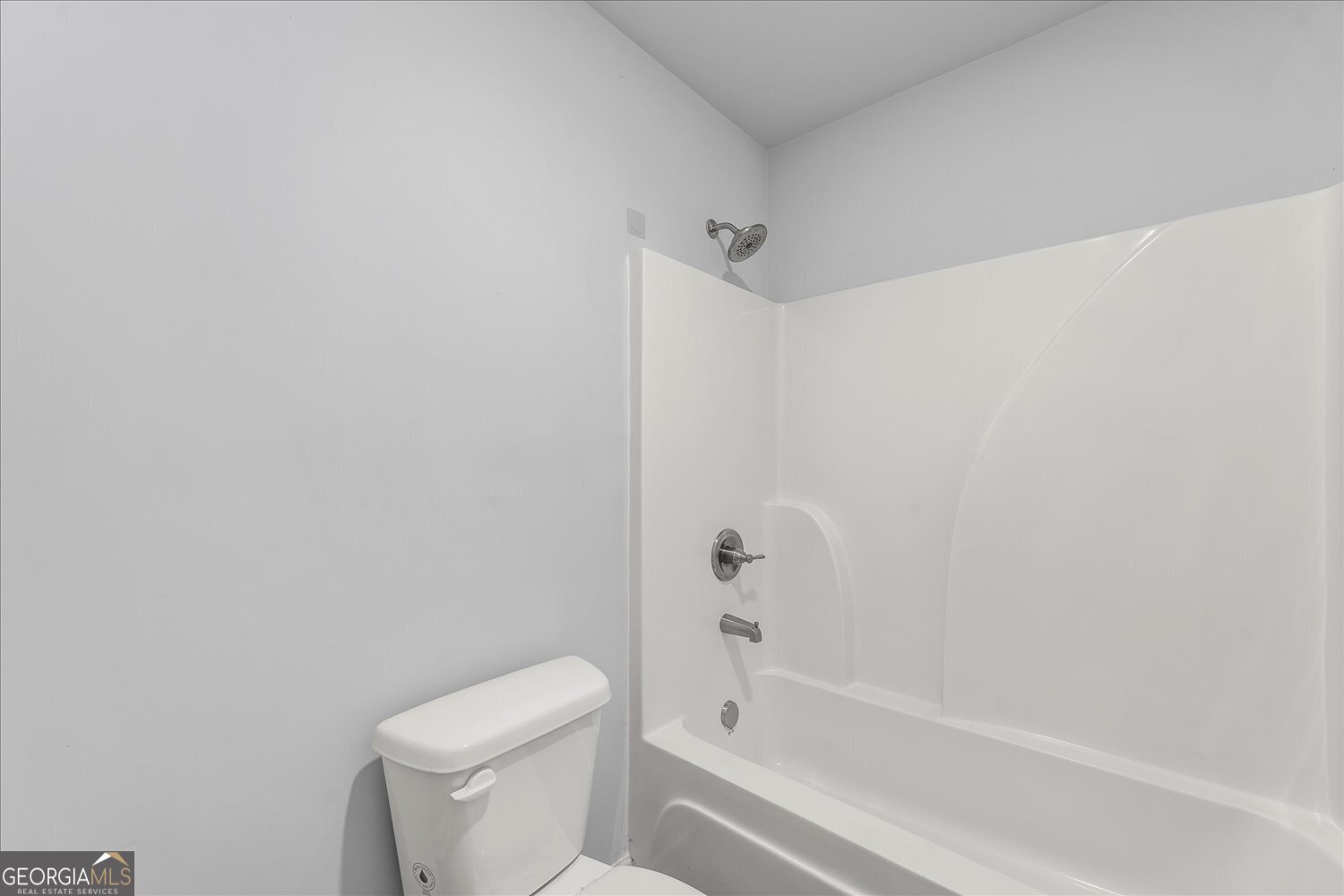 89 Cowpen Court Covington, GA 30014 - Photo 19 of 44 a bathroom with a toilet and a bathtub