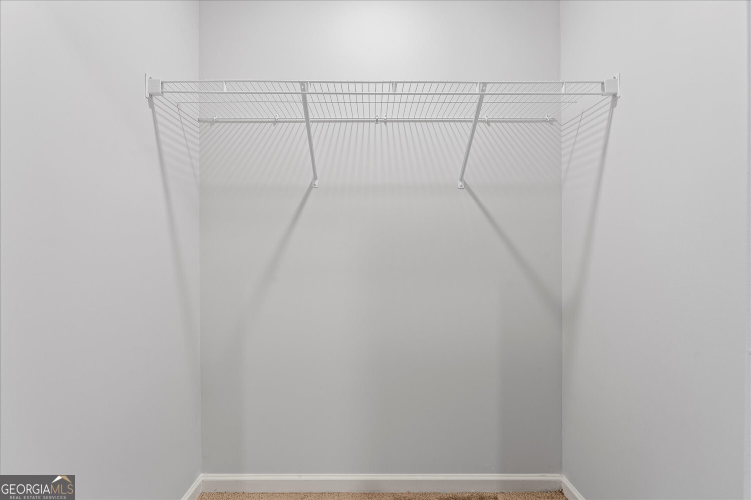 89 Cowpen Court Covington, GA 30014 - Photo 30 of 44 a view of a room with racks on the wall