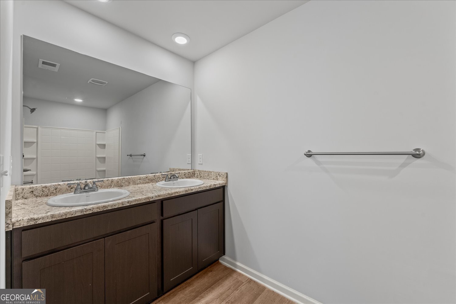 89 Cowpen Court Covington, GA 30014 - Photo 35 of 44 a bathroom with a granite countertop sink and a mirror