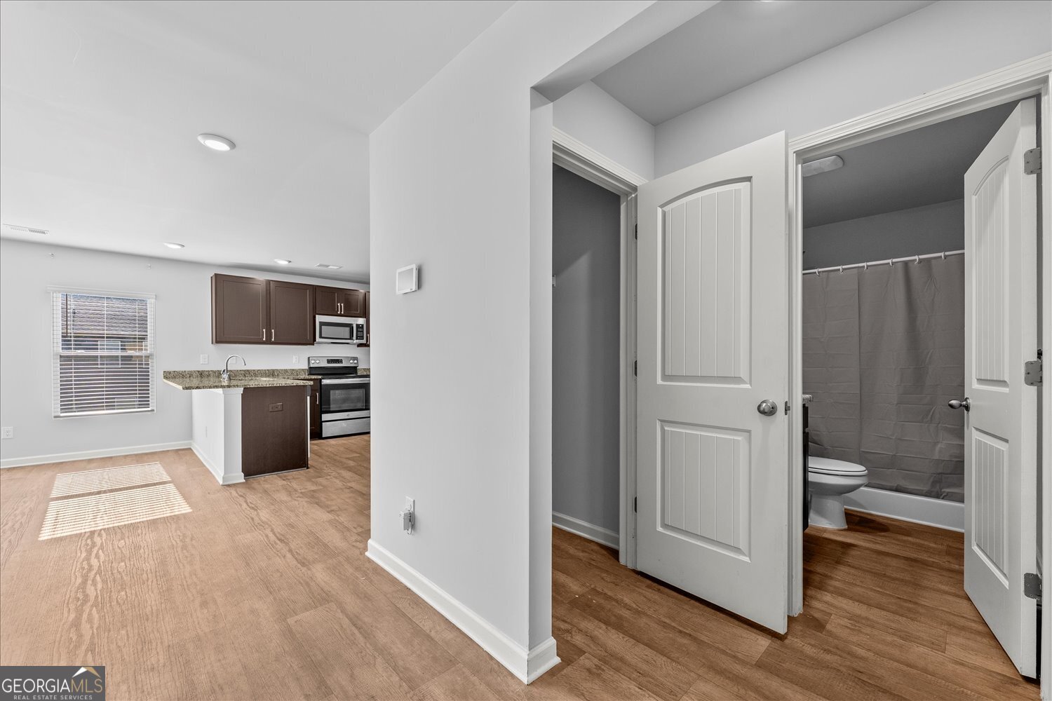 89 Cowpen Court Covington, GA 30014 - Photo 7 of 44 a kitchen with stainless steel appliances a refrigerator and a stove top oven