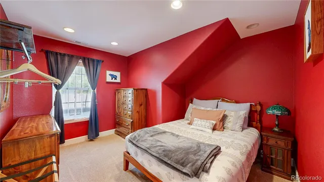 a bed room with a bed and a lamp