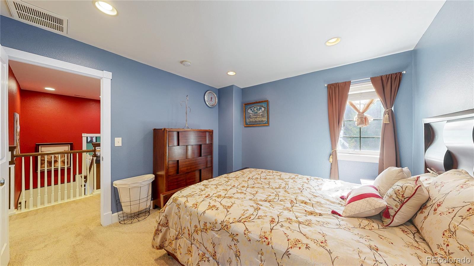 1431 Marion Street Georgetown, CO 80444 - Photo 19 of 50 a bedroom with a bed and dresser with mirror