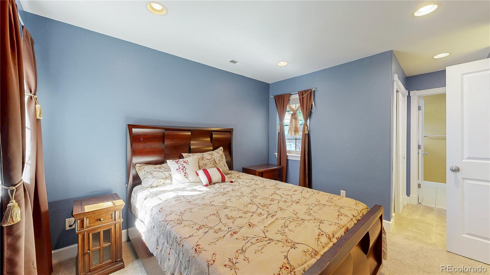 1431 Marion Street Georgetown, CO 80444 - Photo 20 of 50 a bedroom with a bed and a lamp on dresser