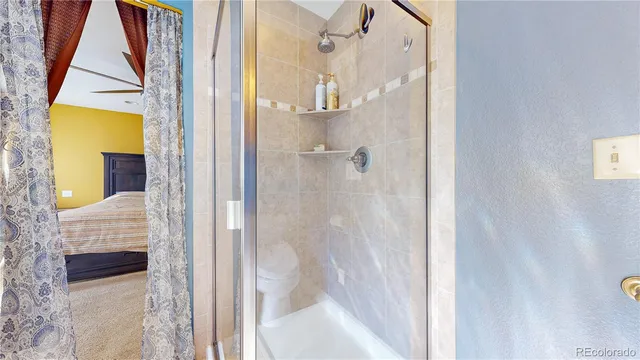 a bathroom with a glass shower door