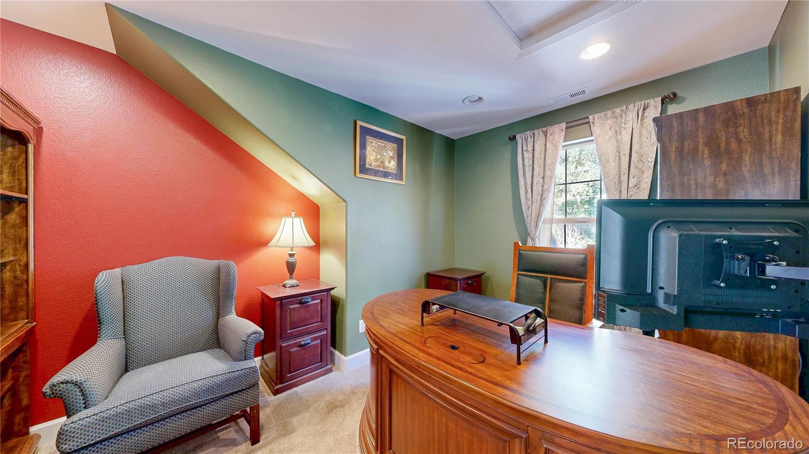 1431 Marion Street Georgetown, CO 80444 - Photo 28 of 50 a room with furniture and a fireplace