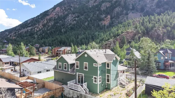 an aerial view of a house with a ocean view
