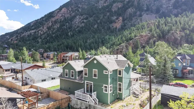 an aerial view of a house with a ocean view
