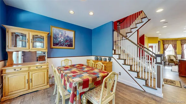 a kitchen with stainless steel appliances granite countertop a sink refrigerator and cabinets