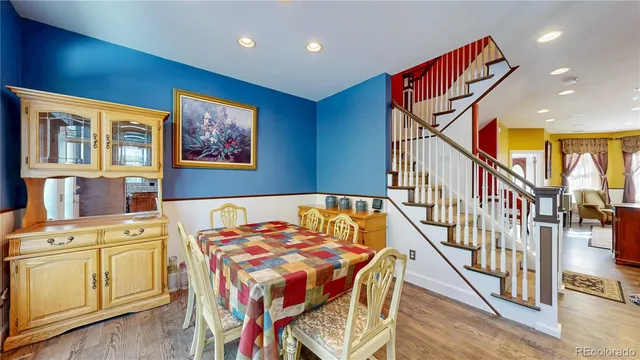 a kitchen with stainless steel appliances granite countertop a sink refrigerator and cabinets
