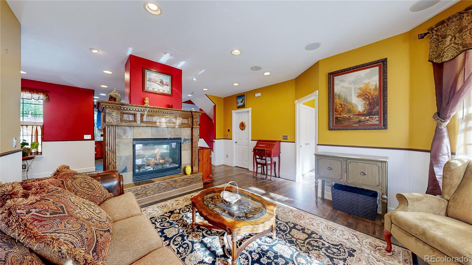 1431 Marion Street Georgetown, CO 80444 - Photo 46 of 50 a living room with furniture a fireplace and a flat screen tv