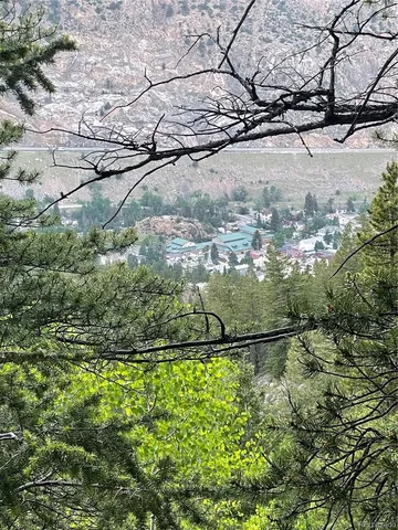 a view of a patio with table and chairs potted plants