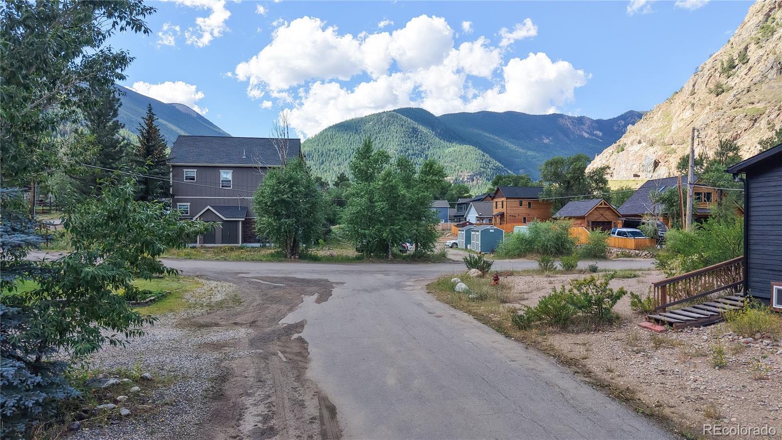 1431 Marion Street Georgetown, CO 80444 - Photo 9 of 50 a view of a house with a small yard and a large tree