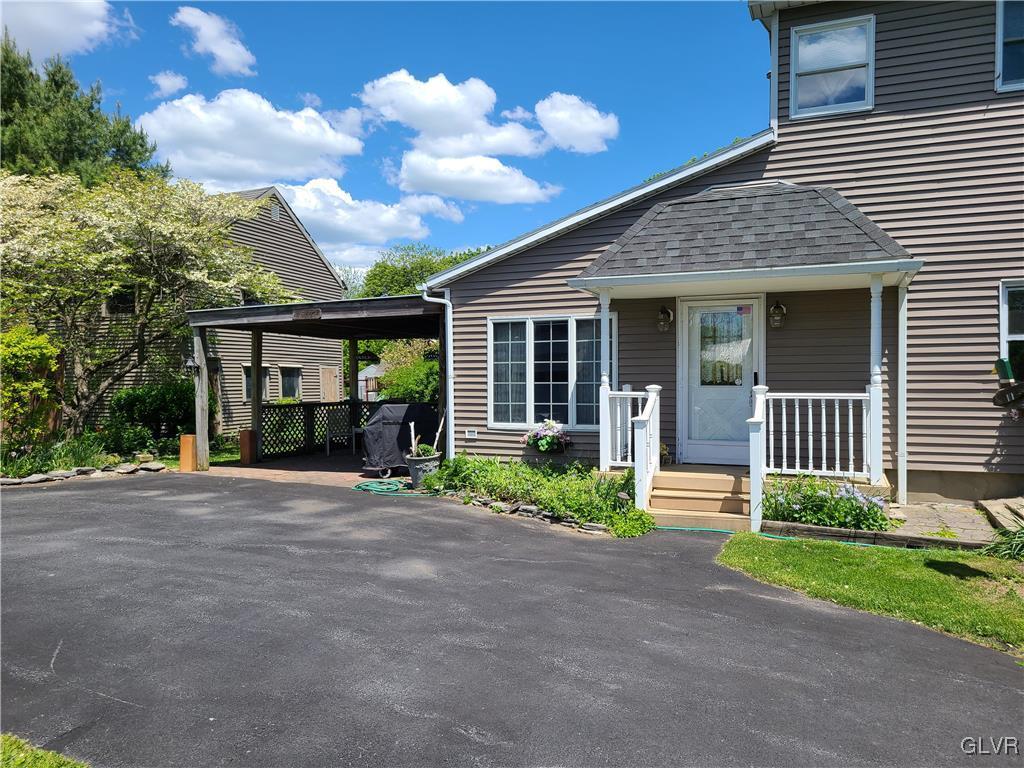 483 Jacobsburg Road Nazareth, PA 18064 - Photo 4 of 19 a front view of a house with garden