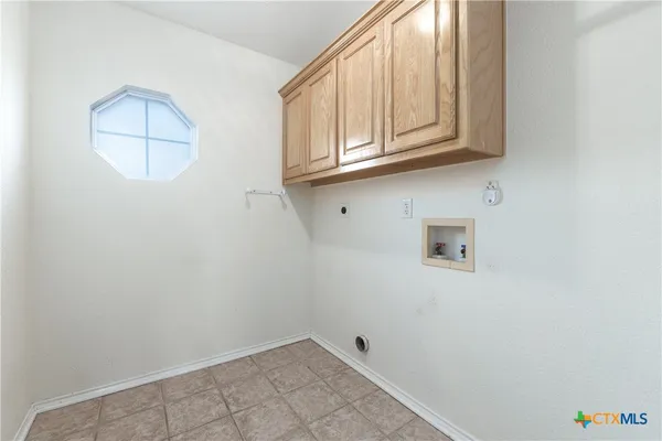 an empty room with windows and outdoor view