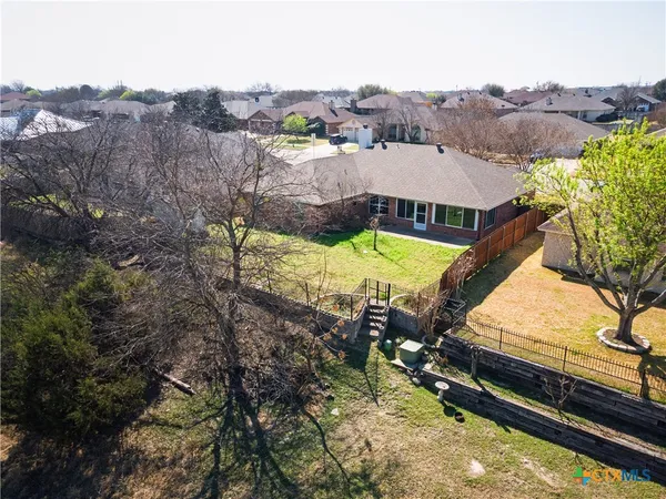 a view of a garden with a bench