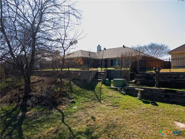 a backyard of a house with lots of green space