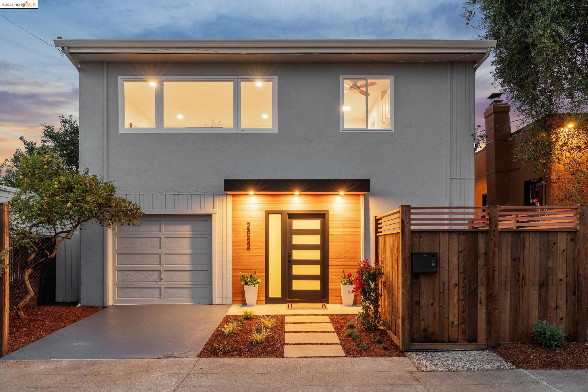 2824 Wallace Street Berkeley, CA 94702 - Photo 1 of 1 a view of a house with many windows and plants