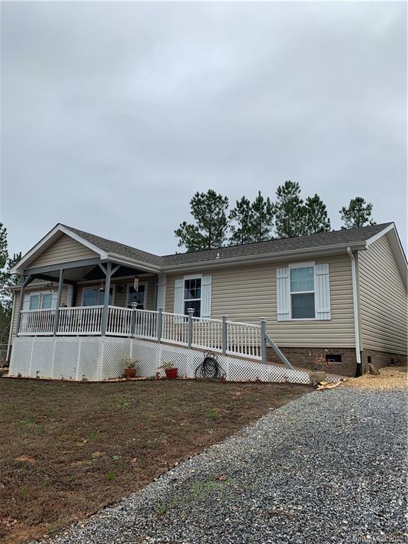 170 Austin Circle Rutherfordton, NC 28139 - Photo 1 of 11 a front view of a house with a yard and garage