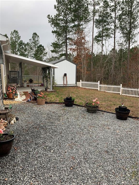 170 Austin Circle Rutherfordton, NC 28139 - Photo 3 of 11 a backyard of a house with table and chairs