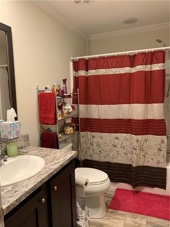 170 Austin Circle Rutherfordton, NC 28139 - Photo 6 of 11 a bathroom with a granite countertop toilet sink and mirror