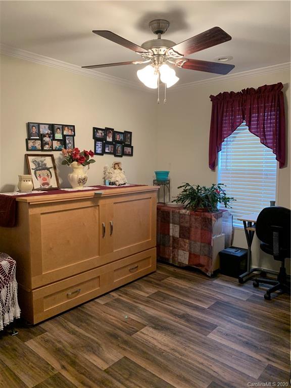 170 Austin Circle Rutherfordton, NC 28139 - Photo 7 of 11 a room with kitchen island stainless steel appliances a couch and a chandelier