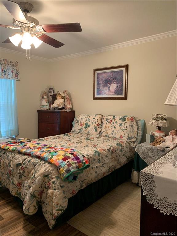 170 Austin Circle Rutherfordton, NC 28139 - Photo 8 of 11 a bedroom with bed and a chandelier