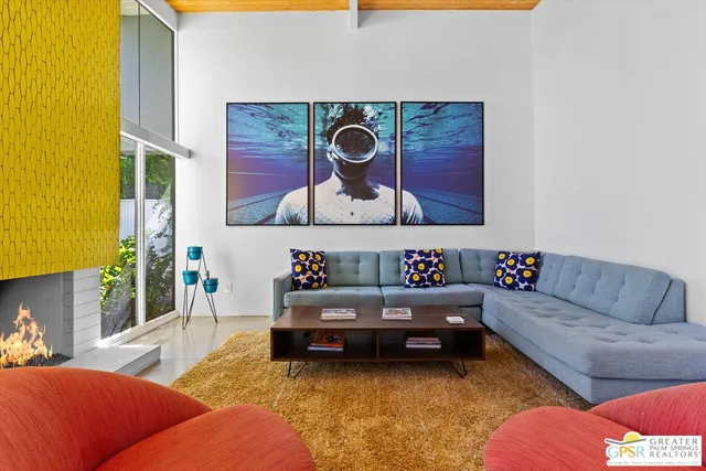 a living room with furniture and bathroom