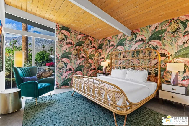 a view of a patio with couches table and chairs and potted plants
